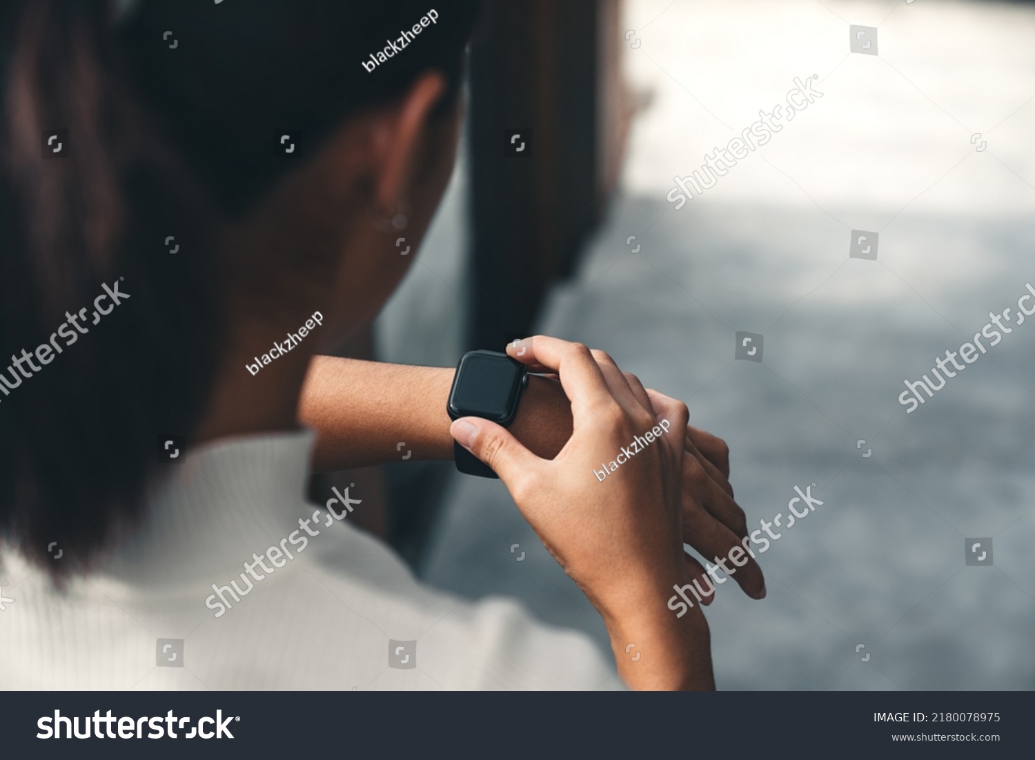 Woman using her Apple Watch
